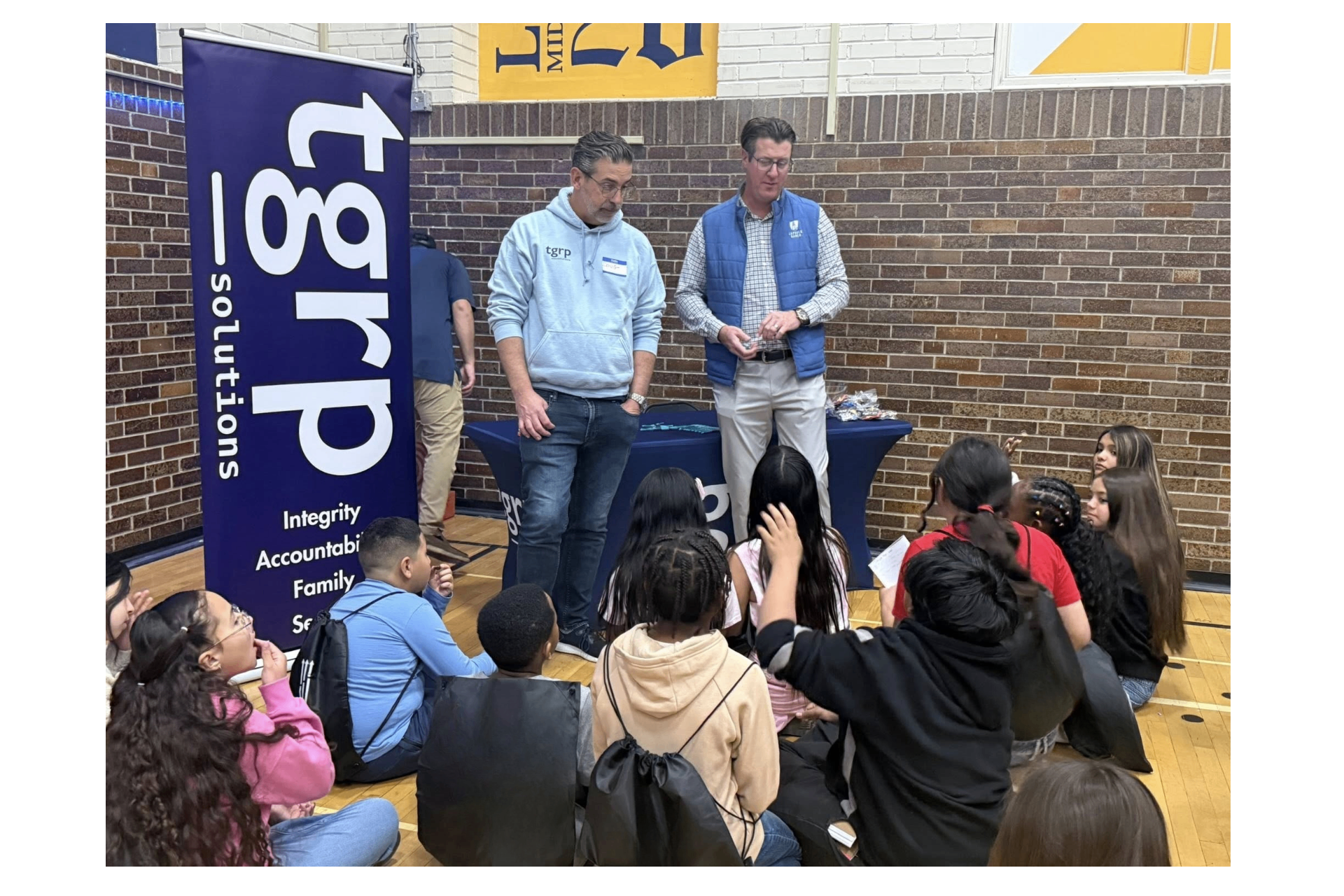 Community volunteers engaging with students at a school event